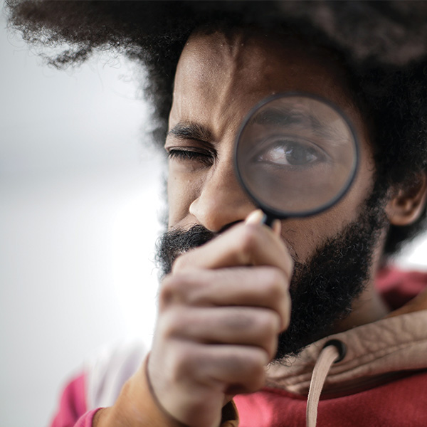 Man using looking glass | HR agency