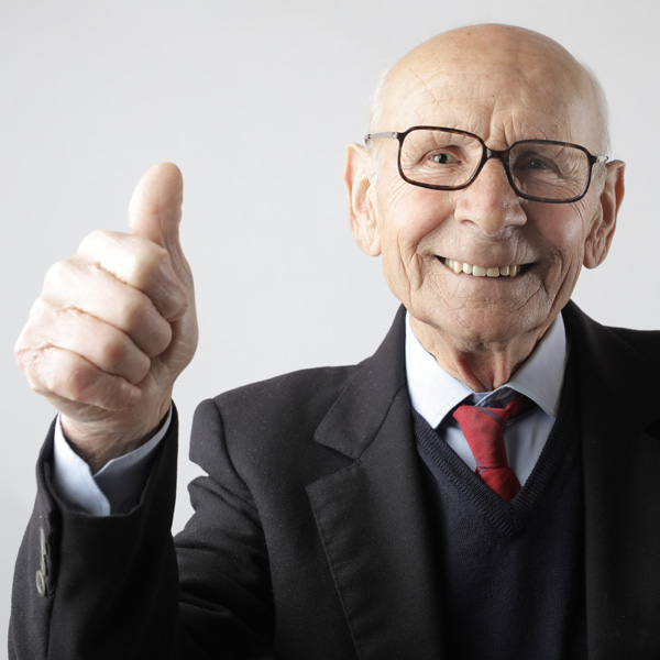 elderly man smiles with thumb up | HR Strategy